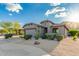 Charming home featuring desert landscaping, a two-car garage, and a desert-toned facade at 343 W Twin Peaks Pkwy, San Tan Valley, AZ 85143
