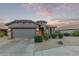 Charming home featuring desert landscaping, a two-car garage, and a desert-toned facade at 343 W Twin Peaks Pkwy, San Tan Valley, AZ 85143