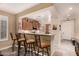 Open-concept kitchen featuring bar seating, pendant lighting, and modern appliances at 343 W Twin Peaks Pkwy, San Tan Valley, AZ 85143