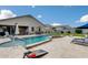 Entertaining backyard features a sparkling pool, spa, and outdoor games for the Gathering at 3515 N Brooklyn Dr, Buckeye, AZ 85396