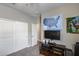 A bedroom featuring carpet flooring, closet, and mounted television at 3515 N Brooklyn Dr, Buckeye, AZ 85396