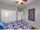 Bedroom featuring a decorative quilt and closet with sliding doors at 3515 N Brooklyn Dr, Buckeye, AZ 85396