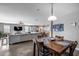 Open-concept dining area flowing into the living room and kitchen, perfect for entertaining at 3515 N Brooklyn Dr, Buckeye, AZ 85396