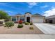 Charming single-story home with well-maintained landscaping and a two-car garage at 3515 N Brooklyn Dr, Buckeye, AZ 85396
