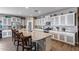 Well-equipped kitchen with a large granite island, stainless steel appliances, and ample cabinet space at 3515 N Brooklyn Dr, Buckeye, AZ 85396