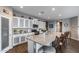 Well-equipped kitchen with granite countertops, stainless steel appliances, and eat-in island at 3515 N Brooklyn Dr, Buckeye, AZ 85396