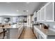 Bright kitchen with granite countertops, stainless steel appliances, and sleek white and gray cabinetry at 3515 N Brooklyn Dr, Buckeye, AZ 85396