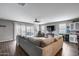 Open-concept living room with access to patio and backyard at 3515 N Brooklyn Dr, Buckeye, AZ 85396