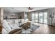Spacious living room that opens onto a backyard with a swimming pool at 3515 N Brooklyn Dr, Buckeye, AZ 85396