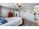 Spacious main bedroom featuring plush carpet, neutral paint, and access to the bathroom at 3515 N Brooklyn Dr, Buckeye, AZ 85396