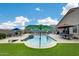 Inviting pool area with a lounge chairs and tables at 3515 N Brooklyn Dr, Buckeye, AZ 85396