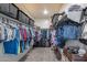 Organized walk-in closet with ample hanging space, shelving, and built-in storage at 3515 N Brooklyn Dr, Buckeye, AZ 85396