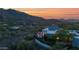 Stunning aerial view of a luxury home with a pool, blending into the desert landscape at 37221 N Holiday Ln, Carefree, AZ 85377