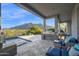 Expansive patio with pool, outdoor kitchen and mountain views, perfect for entertaining at 37221 N Holiday Ln, Carefree, AZ 85377