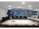 A stylish bar area with a pool table, sleek countertops, custom lighting and comfortable seating for a relaxing ambiance at 37221 N Holiday Ln, Carefree, AZ 85377