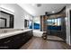 Spa-like bathroom with a soaking tub, dual sinks, walk-in shower, and modern finishes for ultimate relaxation at 37221 N Holiday Ln, Carefree, AZ 85377