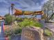 Carefree Desert Gardens with colorful flowers, desert plants, shade structures, and informative signage at 37221 N Holiday Ln, Carefree, AZ 85377