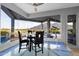 Charming dining area with sleek furniture, expansive views, and a telescope for stargazing at 37221 N Holiday Ln, Carefree, AZ 85377