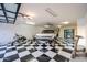 Spacious garage with black and white checkered flooring and ample space for multiple vehicles at 37221 N Holiday Ln, Carefree, AZ 85377