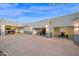A home exterior featuring multiple garages and doors to showcase cars, 4-wheelers, and various other recreational vehicles at 37221 N Holiday Ln, Carefree, AZ 85377