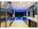 Modern kitchen featuring stainless steel appliances, sleek cabinetry, and ambient lighting at 37221 N Holiday Ln, Carefree, AZ 85377