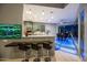 Stylish kitchen featuring a bar area and an adjacent dining area, creating an ideal space for entertaining at 37221 N Holiday Ln, Carefree, AZ 85377