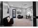 Home office with cozy seating, a modern desk, and lots of natural light for a productive workspace at 37221 N Holiday Ln, Carefree, AZ 85377