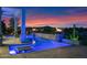 Stunning pool with fire bowls, set against a dramatic sunset and mountain backdrop at 37221 N Holiday Ln, Carefree, AZ 85377