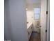 Bathroom showcasing a white vanity, modern mirror, and plenty of natural light at 3911 S 78Th Ln, Phoenix, AZ 85043