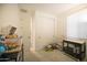 Well-lit bedroom with closet, window and neutral carpet at 3911 S 78Th Ln, Phoenix, AZ 85043