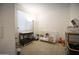 Sunlit Bedroom featuring a crib, changing table, and organized storage at 3911 S 78Th Ln, Phoenix, AZ 85043