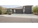 Beautiful exterior featuring a three-car garage, neutral tones, and well-maintained landscaping at 3911 S 78Th Ln, Phoenix, AZ 85043