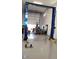 Spacious garage featuring a professional-grade Atlas car lift for auto enthusiasts and home mechanics at 3911 S 78Th Ln, Phoenix, AZ 85043