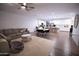 Open concept kitchen and living room with ceiling fan and natural light at 3911 S 78Th Ln, Phoenix, AZ 85043
