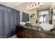 Stylish bathroom with double vessel sinks, granite countertops, and modern fixtures at 4117 W Whispering Wind Dr, Glendale, AZ 85310