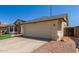 Charming single-story home featuring an attached two-car garage and desert landscaping at 4117 W Whispering Wind Dr, Glendale, AZ 85310