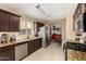 Modern kitchen featuring stainless steel appliances and dark wood cabinetry at 4117 W Whispering Wind Dr, Glendale, AZ 85310