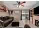 Comfortable living room featuring a fireplace and a sliding glass door to the backyard at 4117 W Whispering Wind Dr, Glendale, AZ 85310