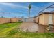 This fenced backyard has a brick patio and grassy areas at 4160 W Granada Rd, Phoenix, AZ 85009