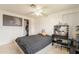 Bedroom showcasing neutral tile flooring, a ceiling fan, and a closet with white doors at 4160 W Granada Rd, Phoenix, AZ 85009