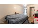 Bedroom with a long bed, and doorway to another room at 4160 W Granada Rd, Phoenix, AZ 85009