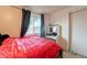 This bedroom has a window, dark drapes, and a vanity table with a mirror at 4160 W Granada Rd, Phoenix, AZ 85009