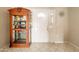 Bright foyer with tile flooring, display case, and decorative wall accents at 4160 W Granada Rd, Phoenix, AZ 85009