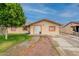 Inviting home featuring a manicured lawn, walkway, and colorful exterior trim at 4160 W Granada Rd, Phoenix, AZ 85009