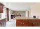 Kitchen island with granite countertops and cabinets, leading to dining area at 4160 W Granada Rd, Phoenix, AZ 85009