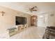 Spacious living room with tile flooring, ceiling fan, and comfortable seating at 4160 W Granada Rd, Phoenix, AZ 85009