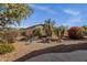 Beautiful backyard with desert landscaping, palm trees, fountain, and a decorative fence for a private outdoor retreat at 4293 E Sourwood Dr, Gilbert, AZ 85298