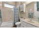 Clean bathroom with a shower/tub combination, white vanity, cabinet, and neutral color scheme, good lighting at 4293 E Sourwood Dr, Gilbert, AZ 85298