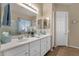 Bright bathroom with double sinks, a large mirror, and neutral decor at 4293 E Sourwood Dr, Gilbert, AZ 85298