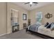 Cozy bedroom with a geometric patterned bedspread, side table, and comfortable seating at 4293 E Sourwood Dr, Gilbert, AZ 85298
